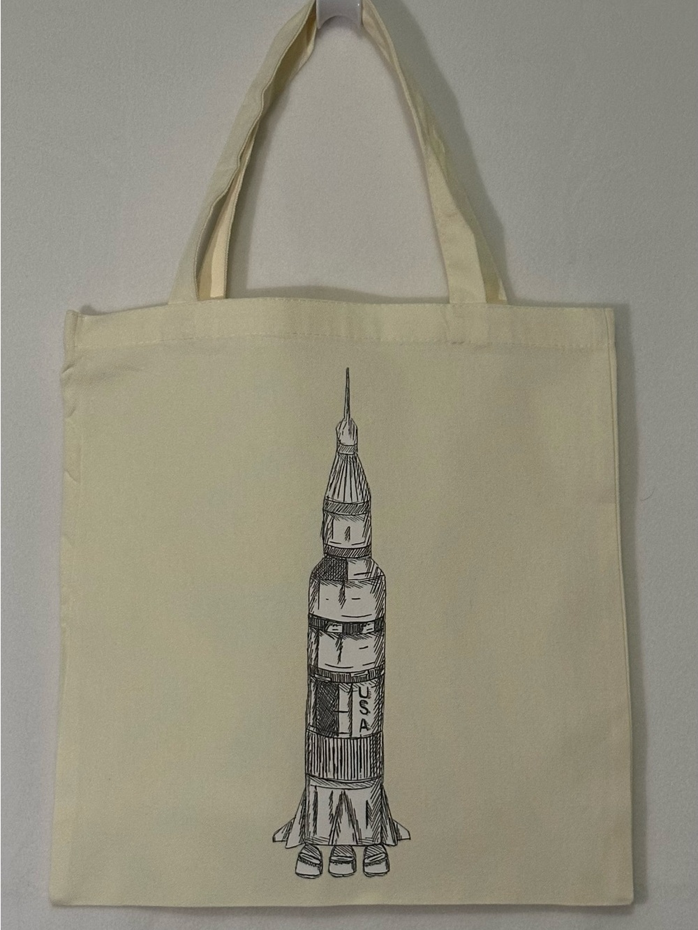 Rocket ship Illustration tote bag cream  color. Size 15”x15”